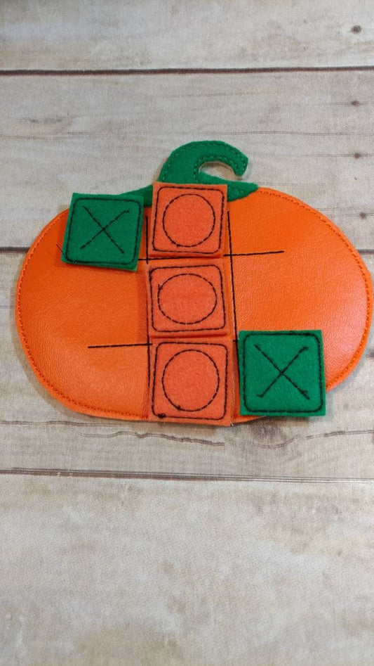 Handcrafted pumpkin tic tac toe game for boys and girls. Can be used as a gift or party favor.