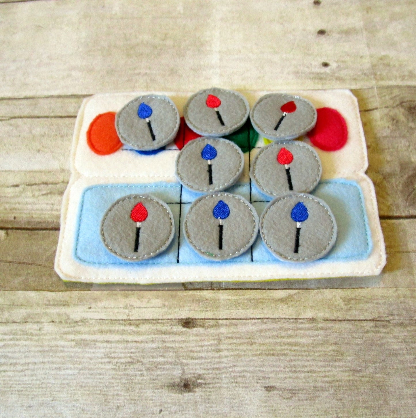 Handcrafted paint palette theme tic tac toe game for the artist boy and girl or girl in your life. Can be used as a gift or party favor.